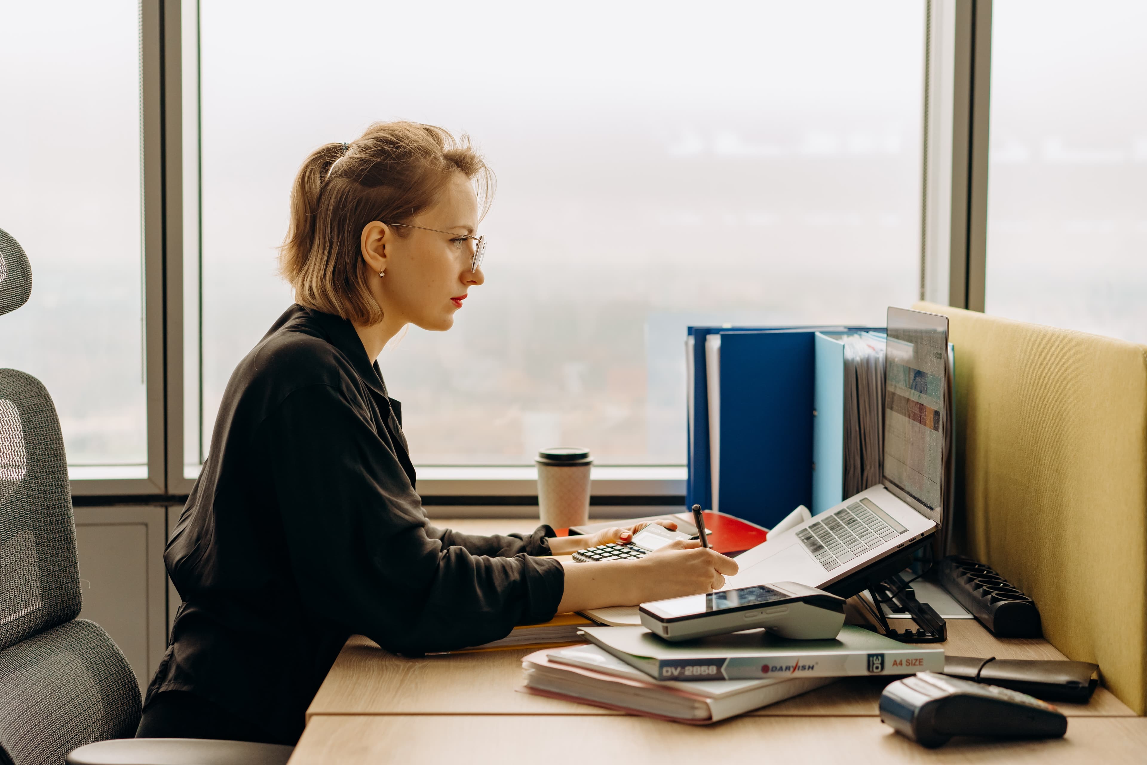 woman working on a laptop at a desk