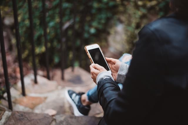 woman holding a phone