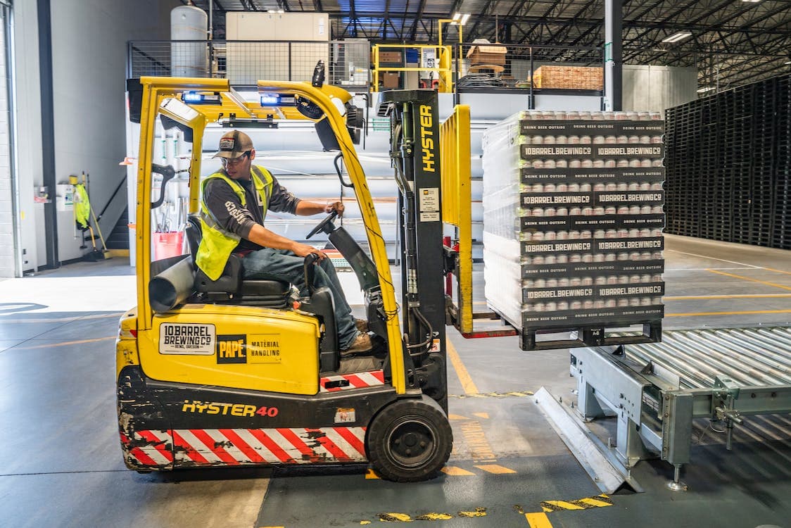 indoor construction equipment moving a pallet